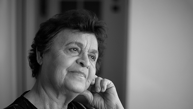hispanic woman looking out a window