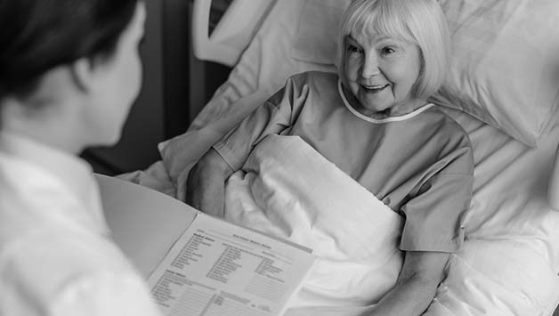 senior woman in hospital bed