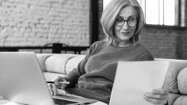 senior woman reading a paper