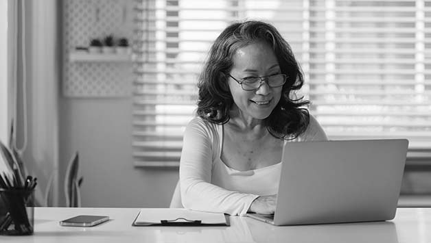 woman typing on laptop