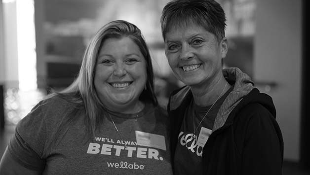 two female employees posing for photo